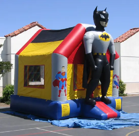 A batman bouncy house in the middle of a parking lot.