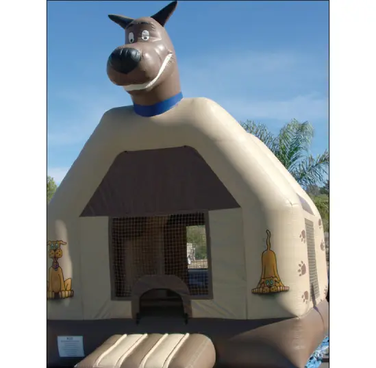 A dog shaped inflatable bounce house with blue sky in background.