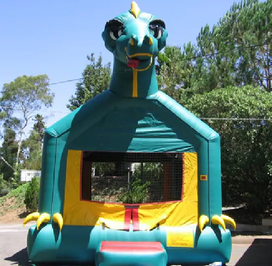 A green and yellow inflatable with a dragon head on it.