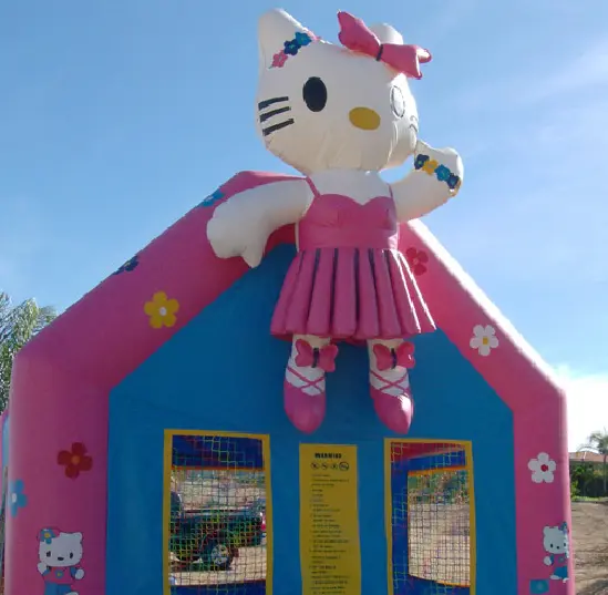 A hello kitty inflatable bounce house with a pink and blue theme.