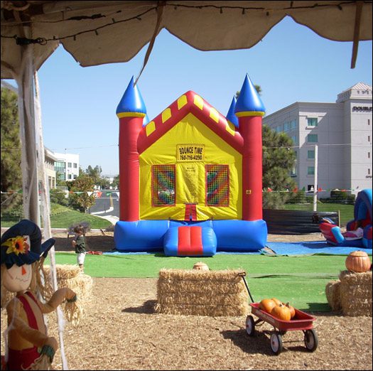 A large inflatable castle in the middle of an outdoor setting.