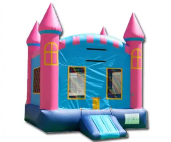 A pink and blue castle bounce house with slide.