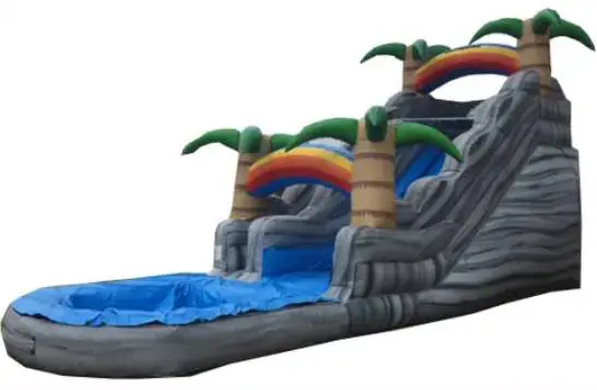 A large inflatable water slide with palm trees.