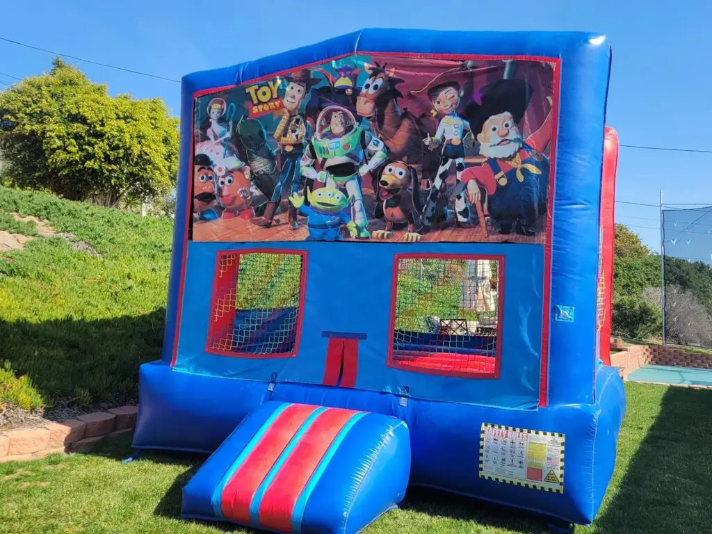 A blue and red inflatable with toy story on it.