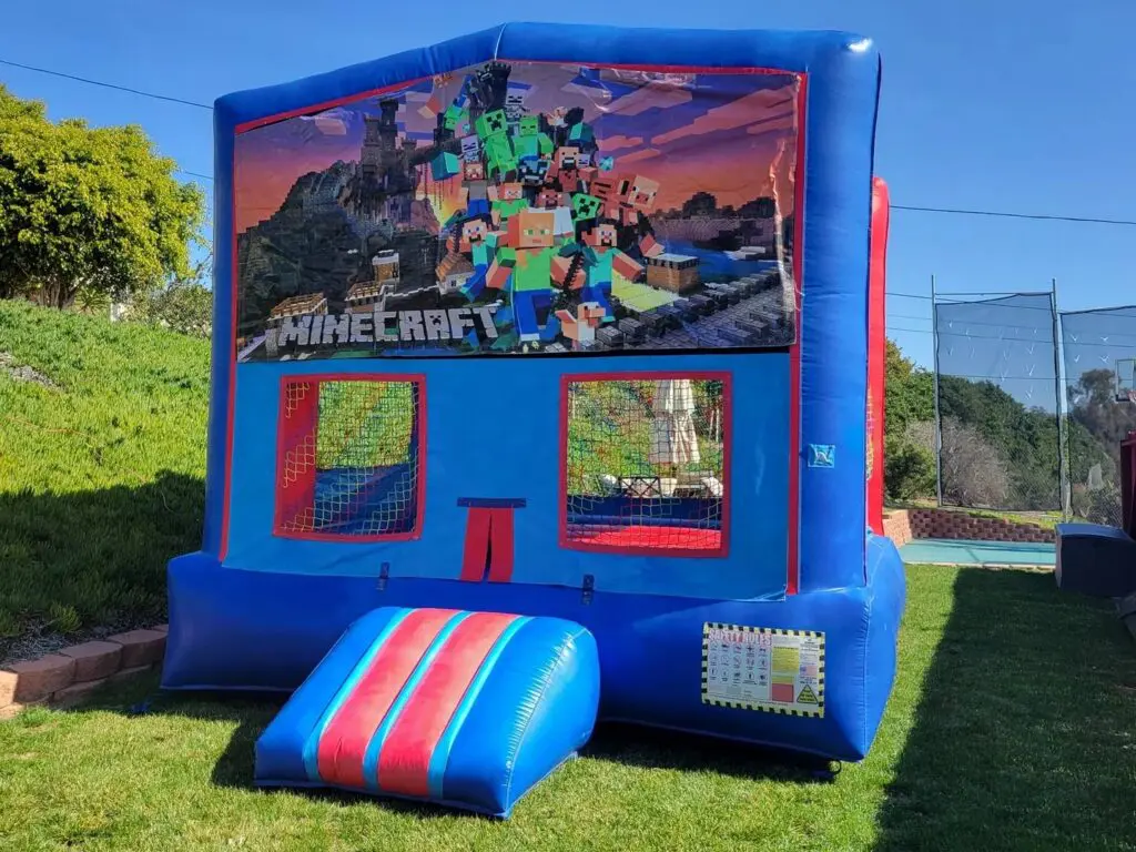 A blue and red inflatable with the word " minecraft " on it.