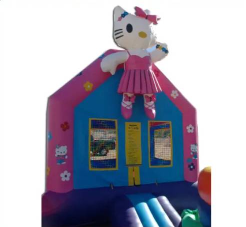 A hello kitty bounce house with a girl on it.